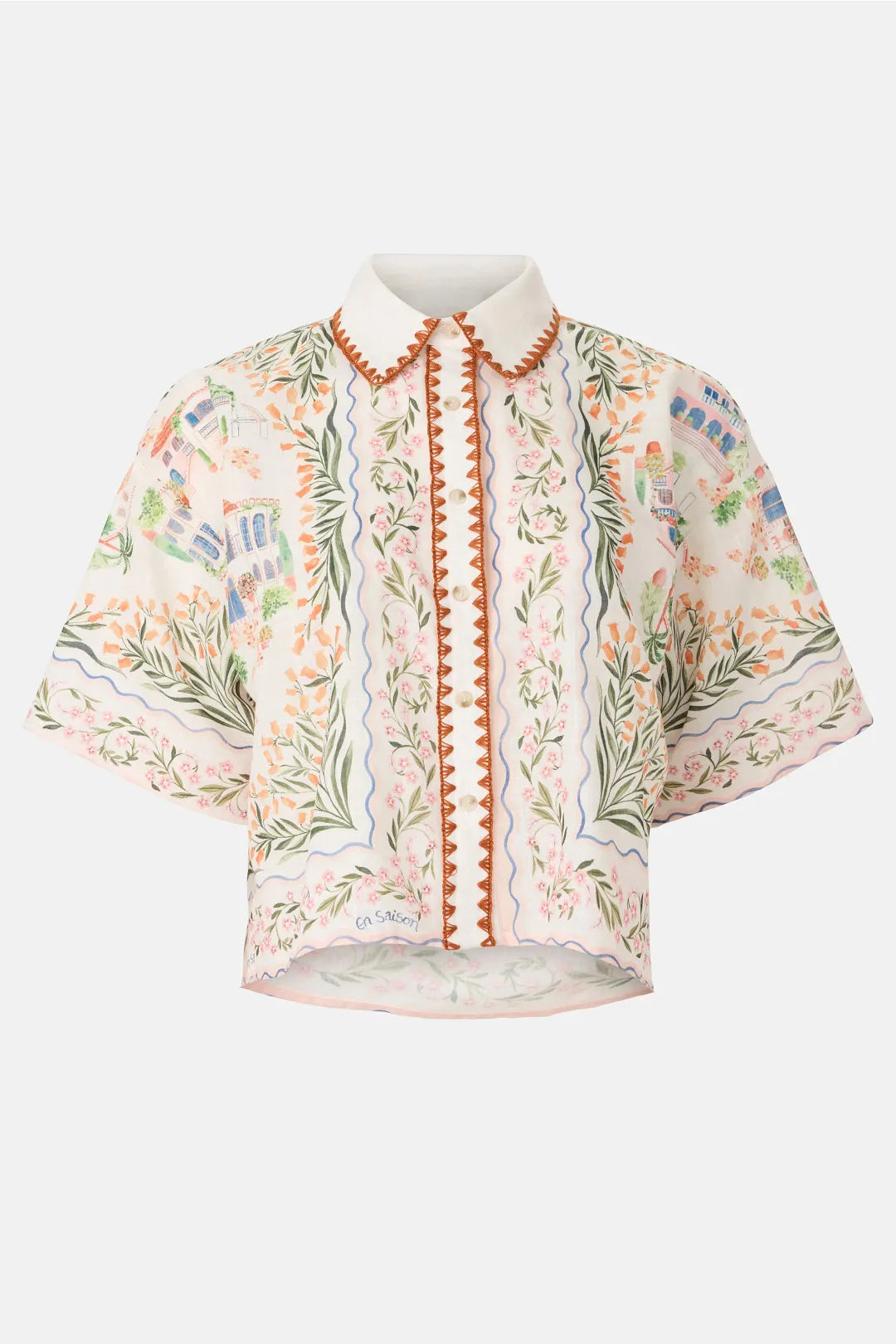 Floral embroidered blouse with orange accents on a white background