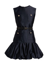 Black dress with gold buttons and a belt on a white background