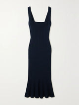 Navy blue dress with a fitted bodice and flared skirt on a light gray background