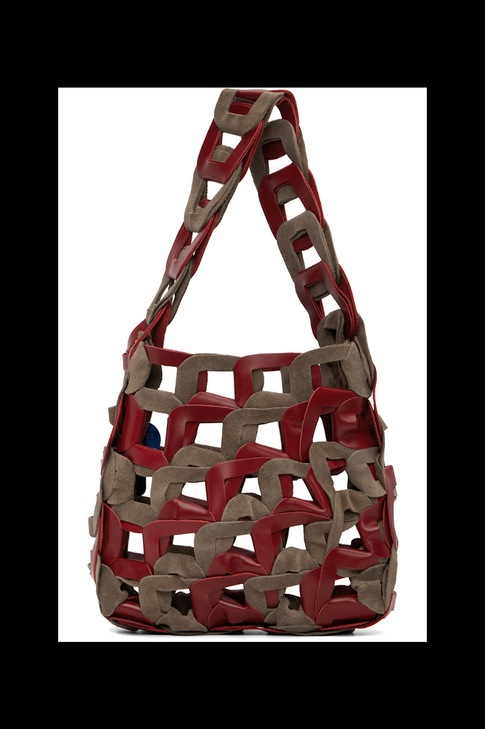 Red and brown woven handbag on a white background