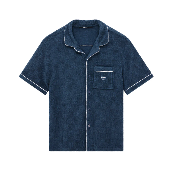 Navy blue pajama shirt with white piping on a white background