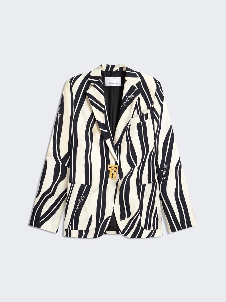 Zebra-striped blazer with gold buttons on a light gray background