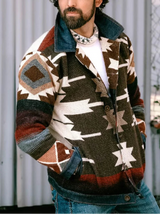 Man wearing a patterned jacket and hat outdoors