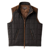 Black quilted vest with brown accents on a white background