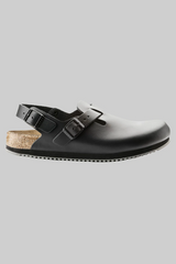 Black sandal with cork sole on a light gray background