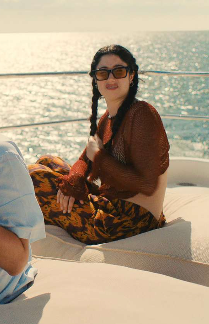 Person sitting on a boat with ocean view