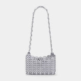 Silver beaded handbag with a chain strap on a light gray background