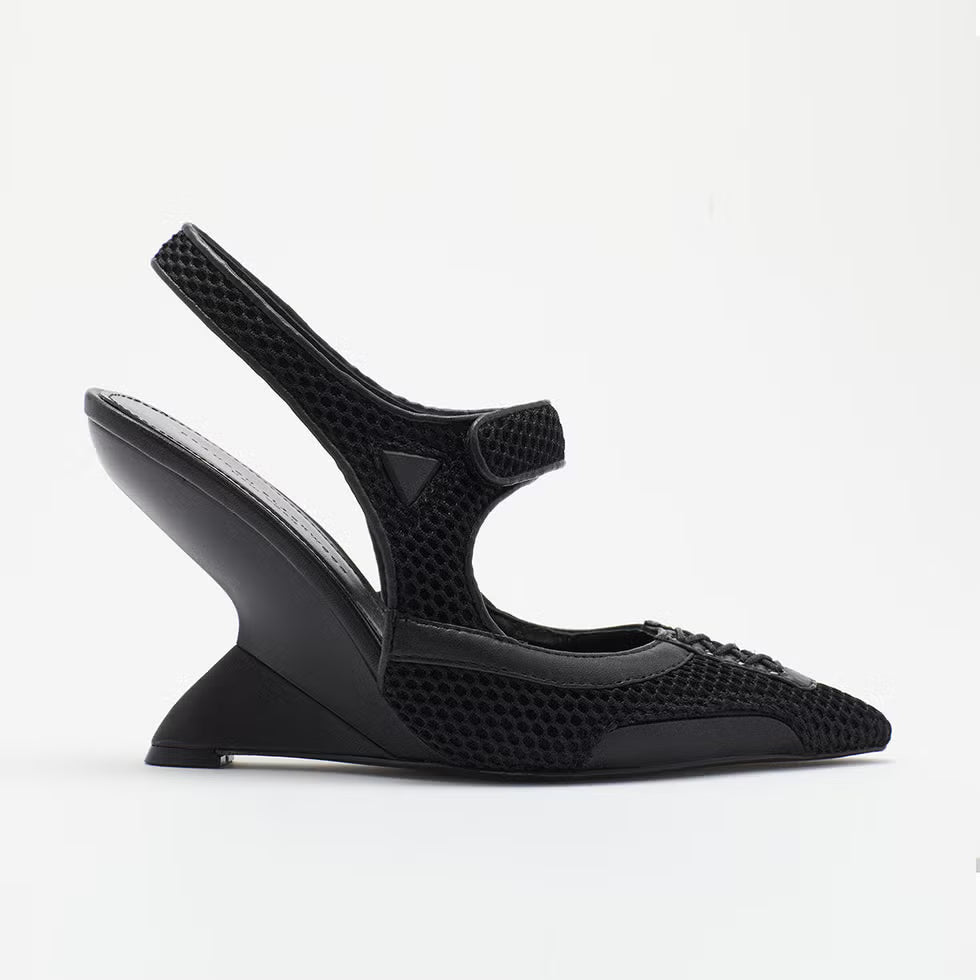 Black sandal with mesh design on a white background