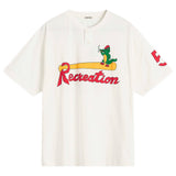 An off-white short-sleeve henley t-shirt featuring a colorful graphic on the chest of a green alligator wearing a red cap and holding a beer, standing on a yellow barrel above the word 'Recreation' in red script. The brand name 'BOOE' is printed inside the collar, and a red '5' is printed on the sleeve.