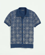 A blue and white batik-inspired block print cotton polo cardigan.