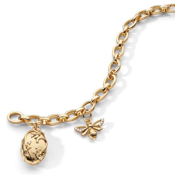 THE “WISTERIA” LOCKET AND “BEE” 18K GOLD CHARM BRACELET with Diamonds